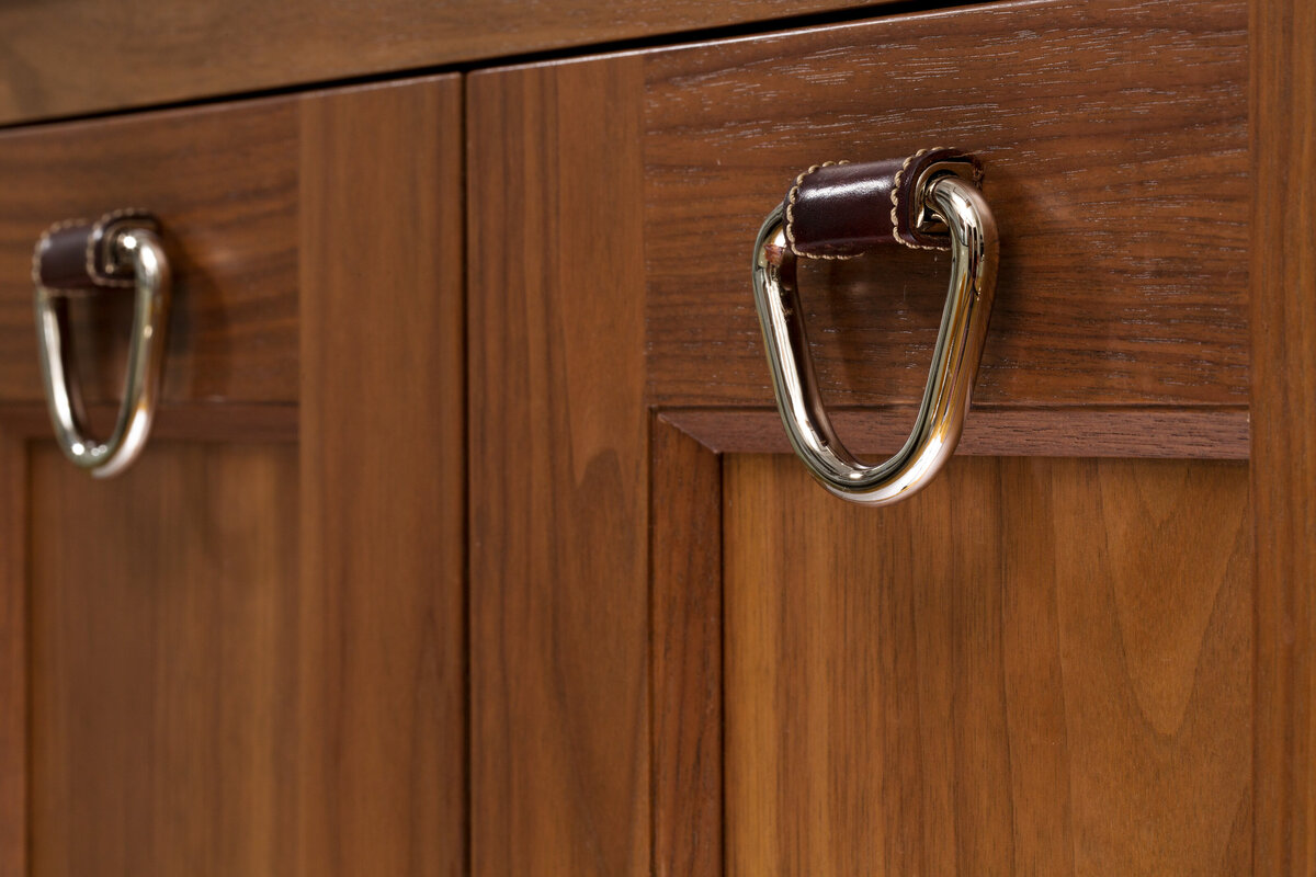 close up of dark wood cabinets with silver handles
