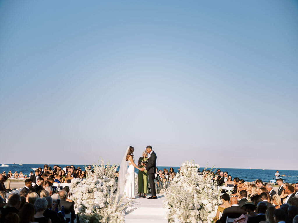 Bride and groom getting married at the Theater at the Lake in Chicago on a sunny day