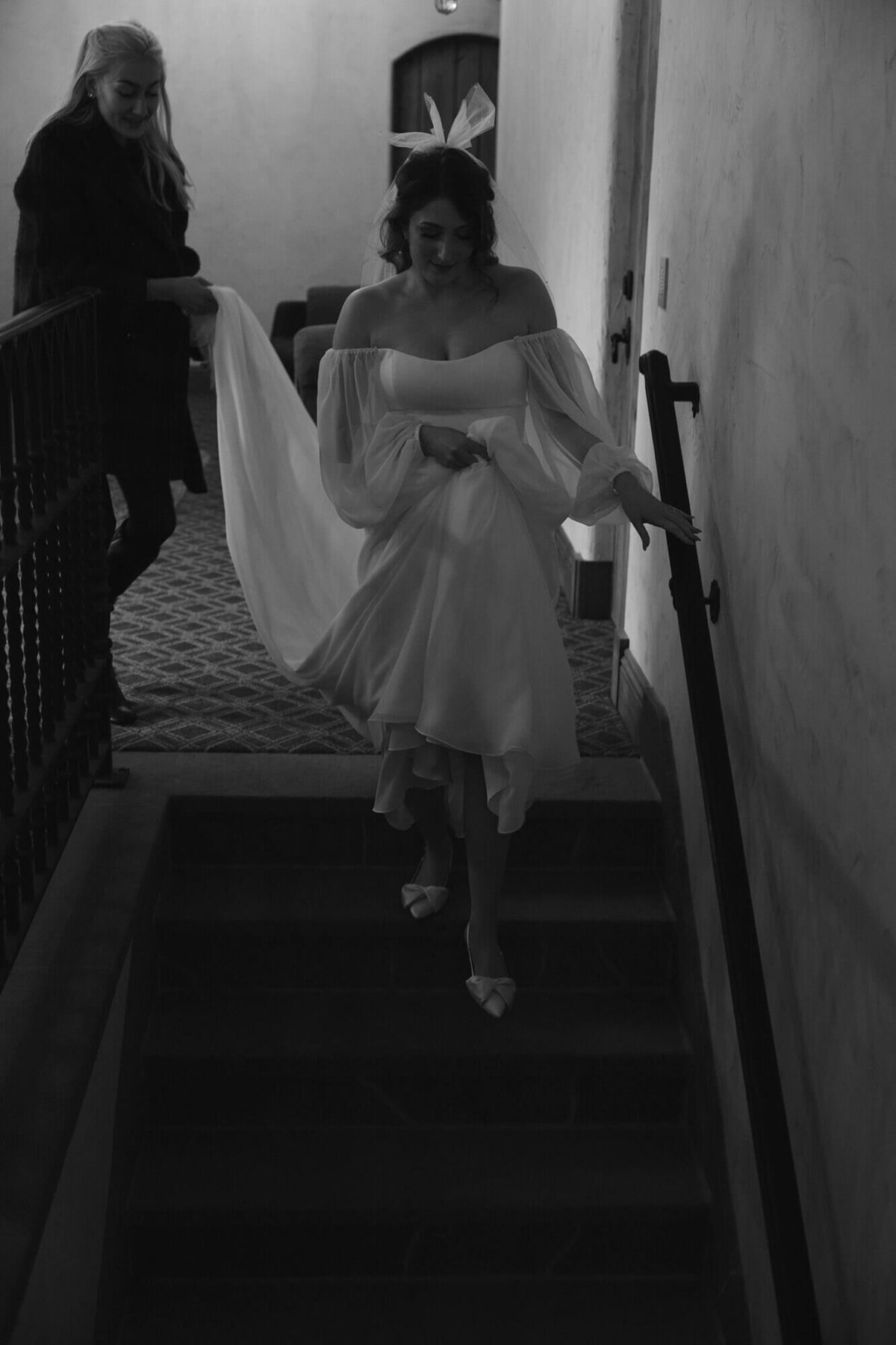 Bride coming down the stairs, representing an example wedding planned by Birdie June in Eugene, Oregon. 