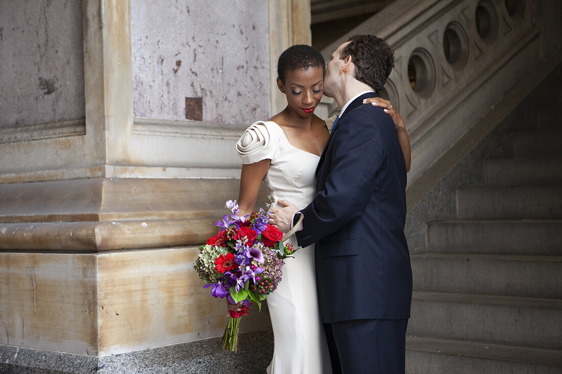 Bride and Groom Embrace at Philadelphia City Hall Wedding 