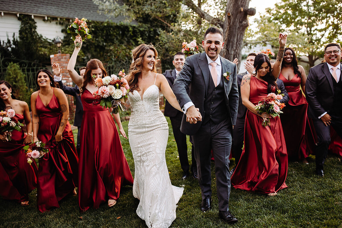 Bride and groom celebrate with their bridal party.