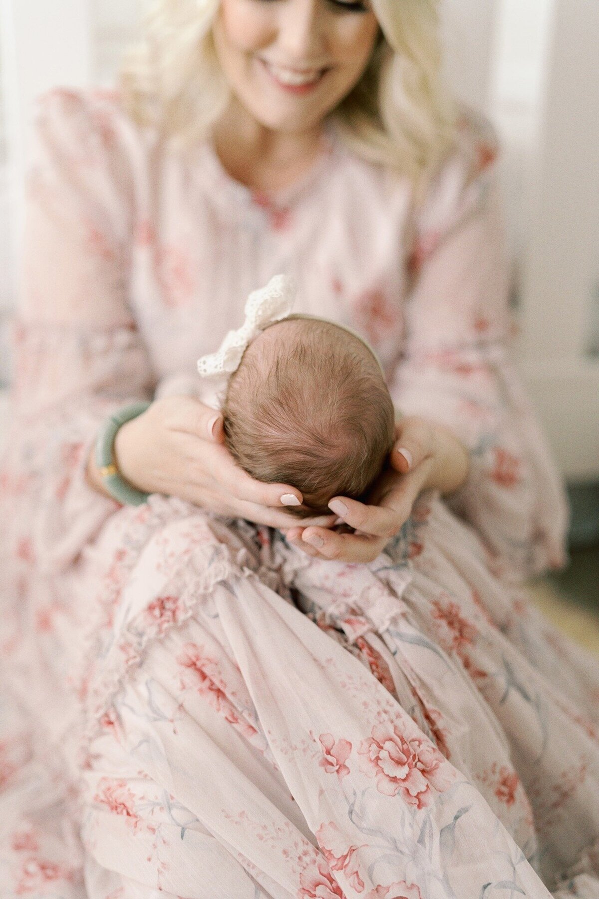 close-up-of-baby-girls-head-in-moms-lap