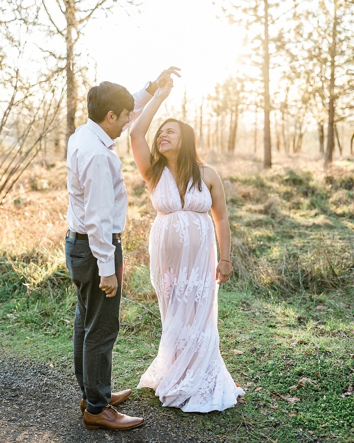 mom and husband for maternity session in Portland area field