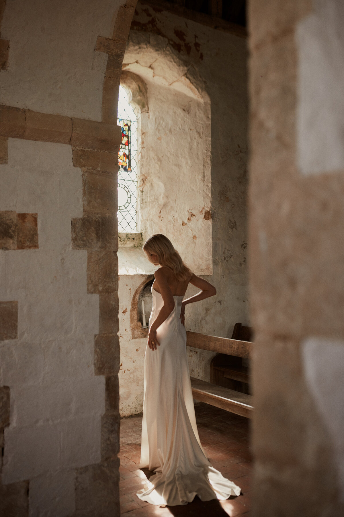 Handmade silk wedding dress, sleeveless, long dress worn by bride in chapel