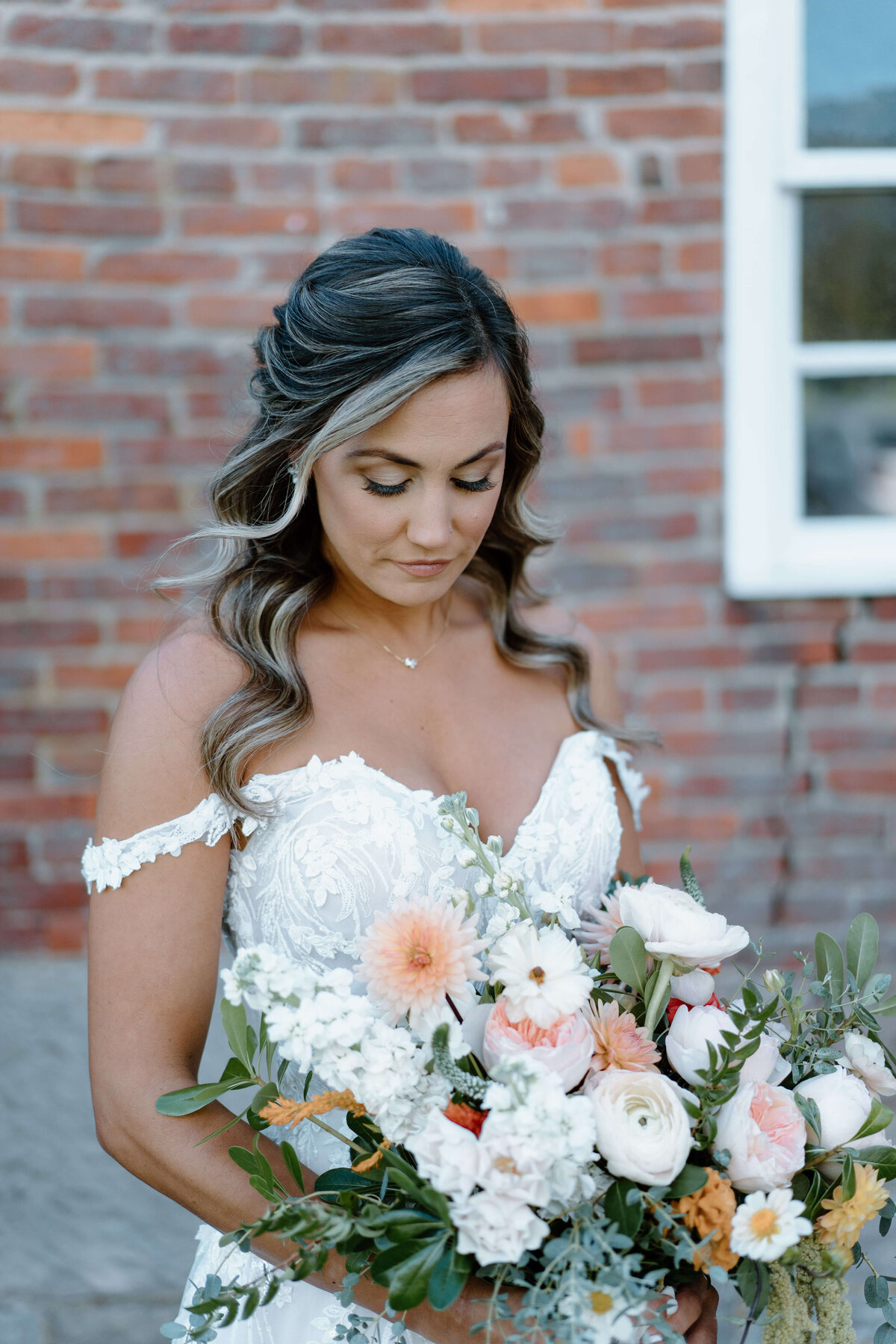 bride holding large bouquet