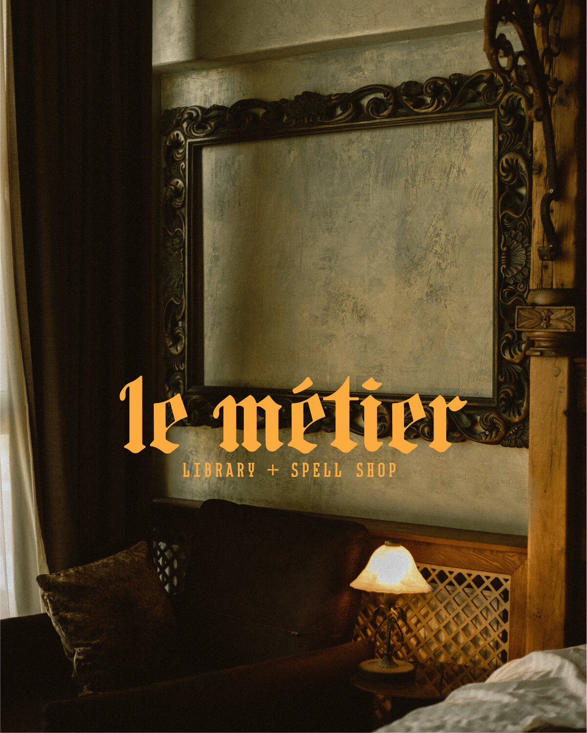 dark academia style sitting room with le metier library and spell shop main logo