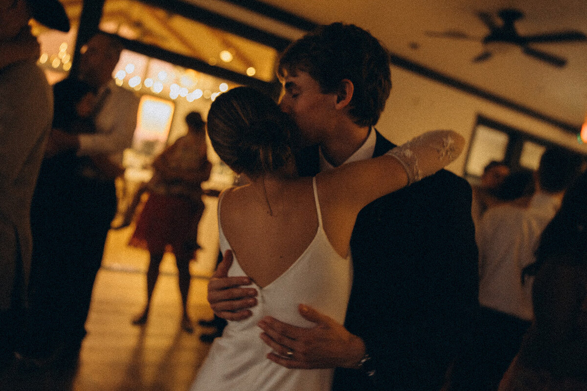 Silhouette of a couple kissing at sunset