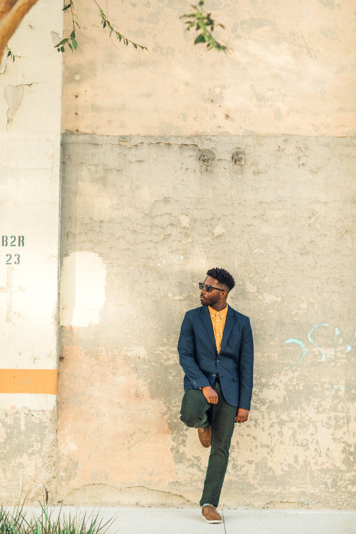 Portrait Photo Of Young Black Man Leaning Against a Wall Los Angeles