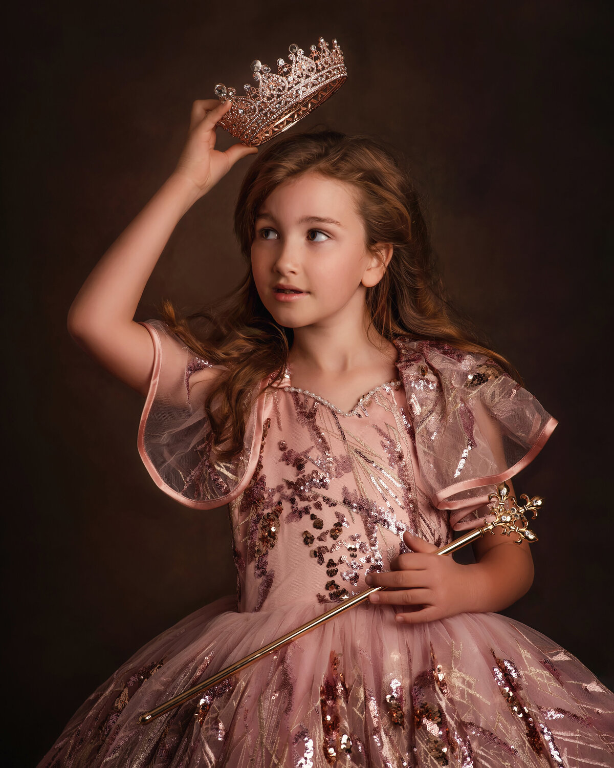 Girl wearing couture dress with crown