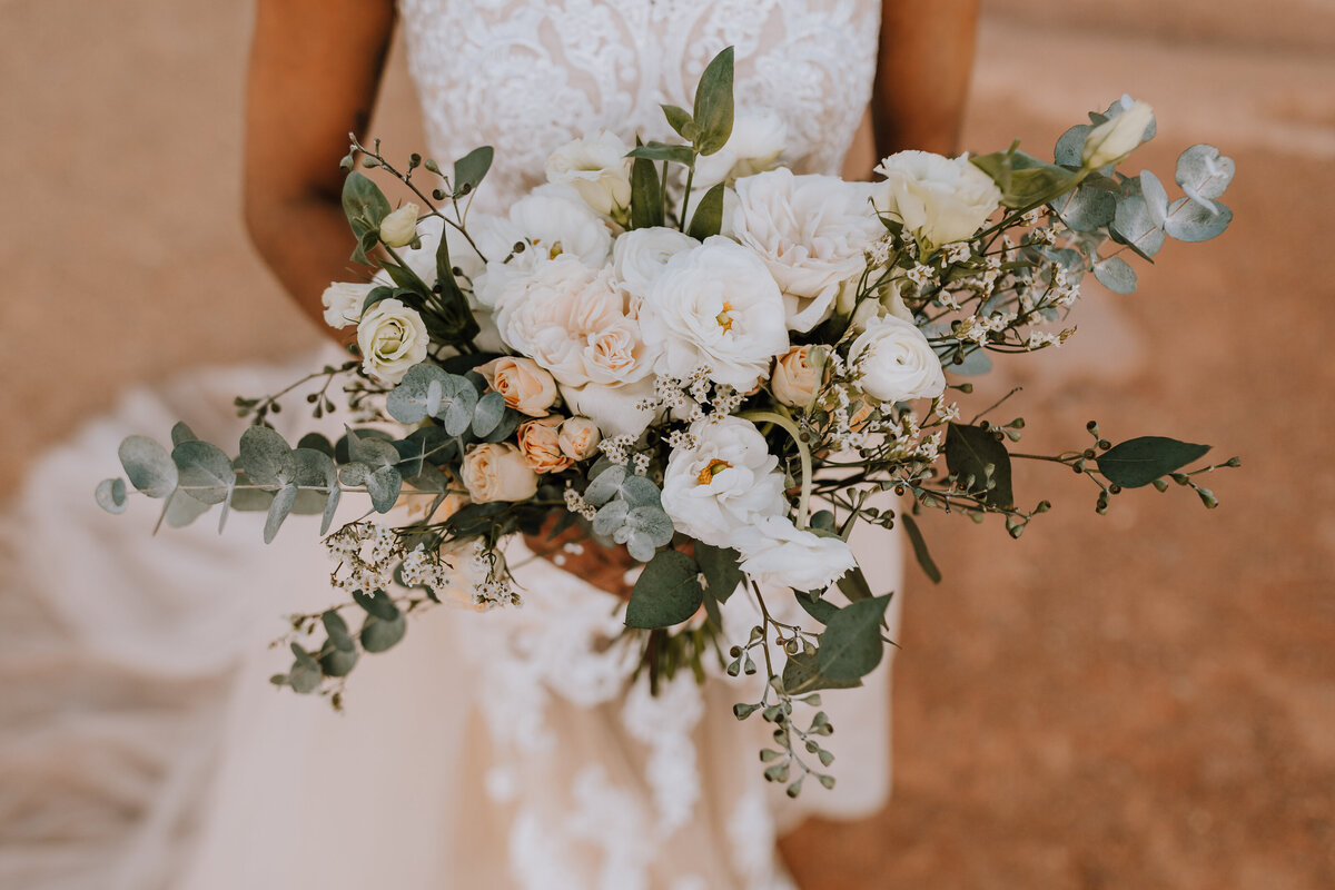 bride holding florals