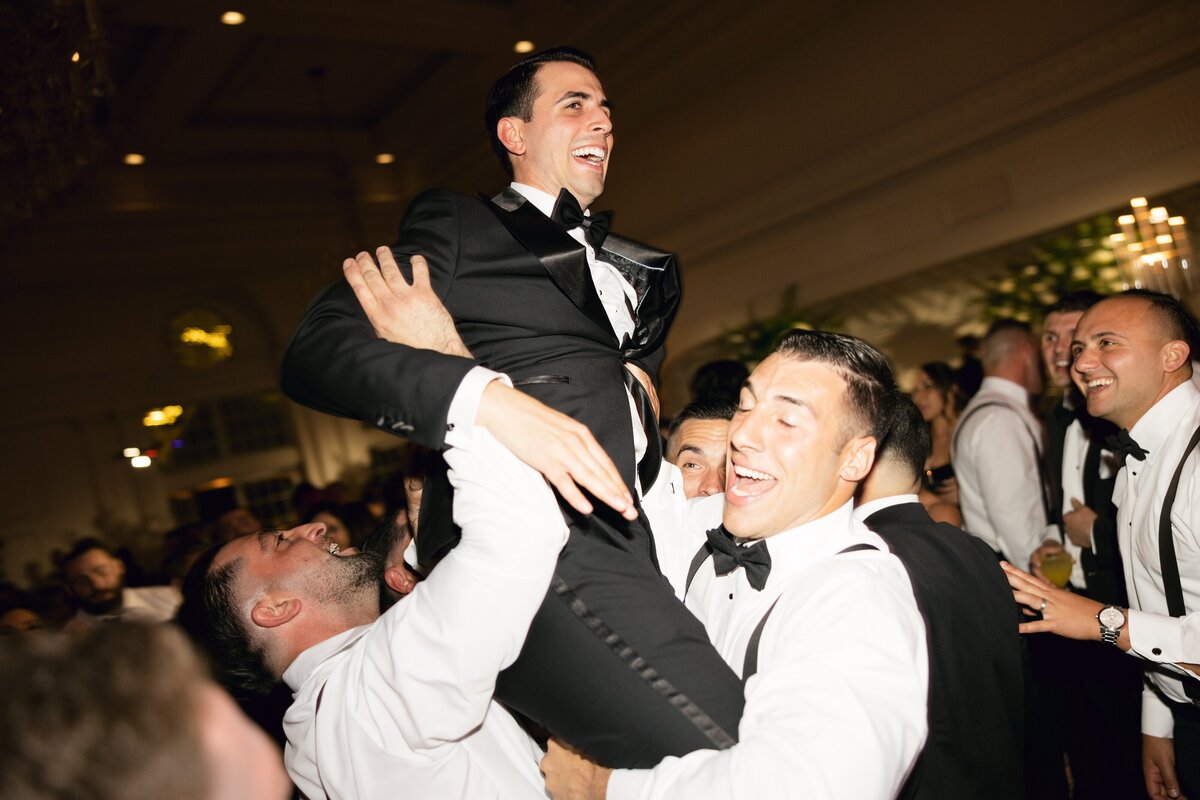 Reception dancing and joyful atmosphere at Park Chateau wedding.


