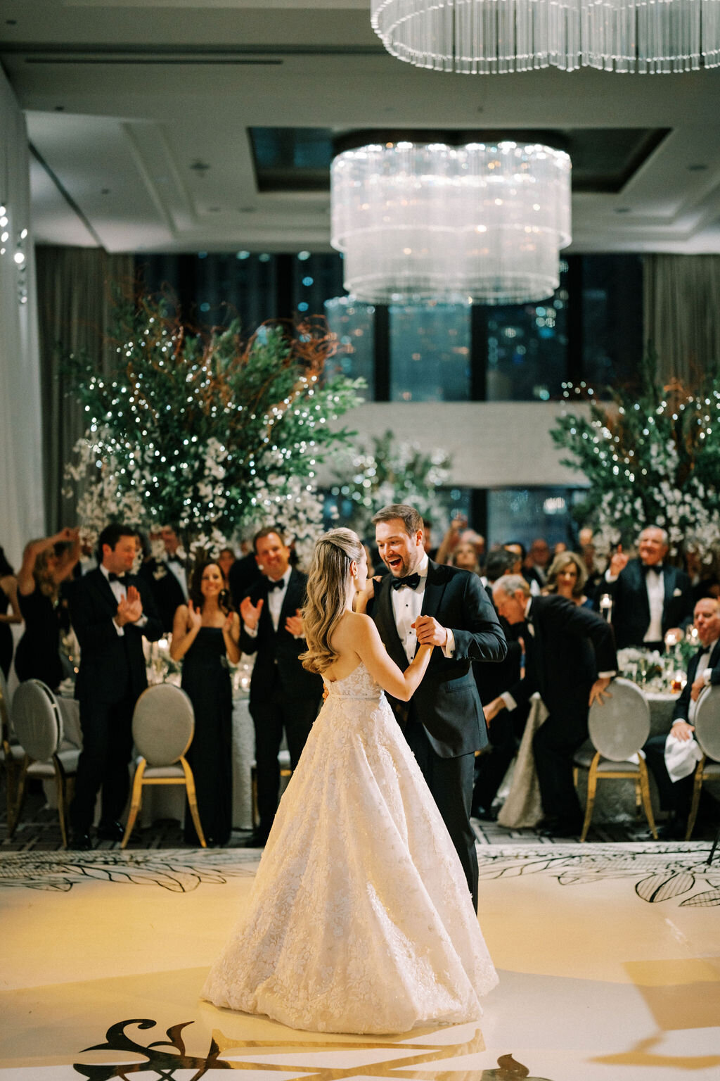 Picture of the bride and groom sharing their first dance. 