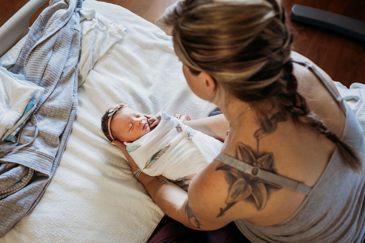 fresh 48 mom holding baby hospital bed-01
