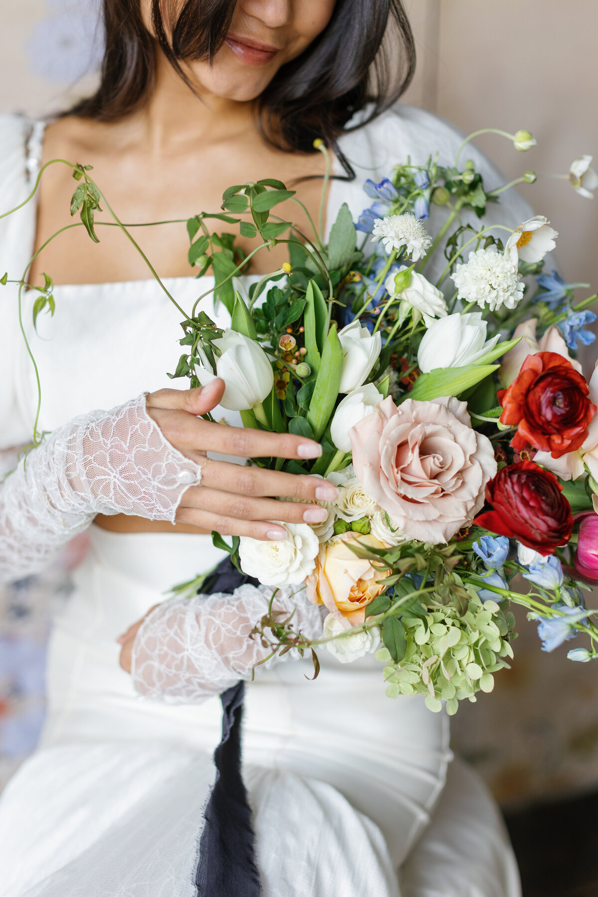 bride-cradling-bouquet
