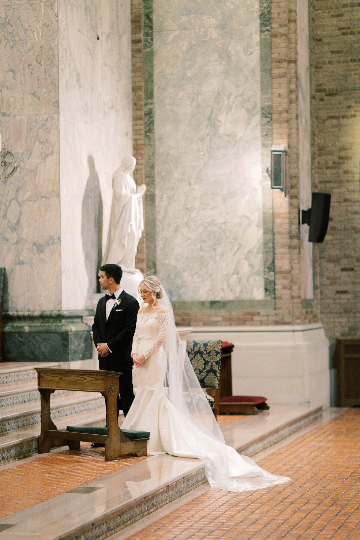 bride and groom at alter getting married in philadelphia church