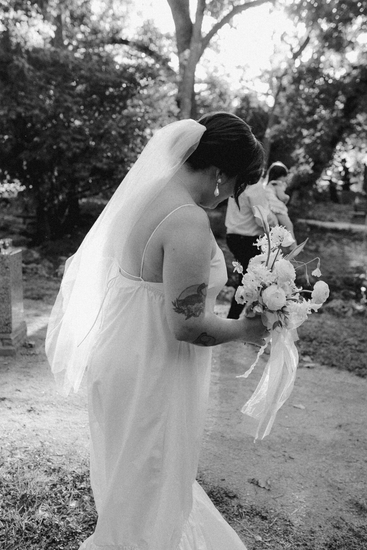 Bride walking through Umlauf Sculpture Garden, Austin