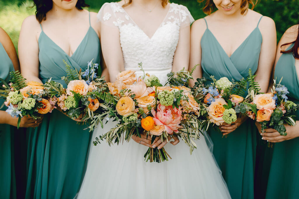 Kaitlin & Joshua wedding - bridal party holding flowers