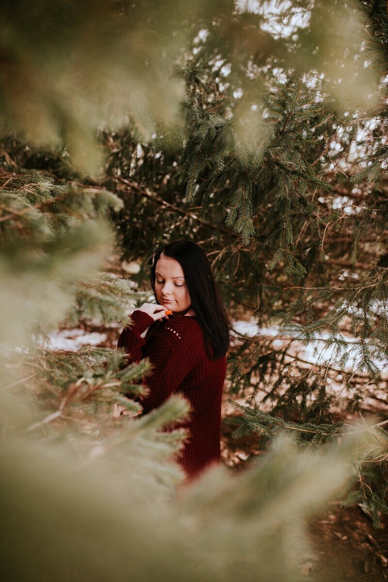 moody-senior-portrait-in-evergreens-iowa-storyteller-collective-photo-co