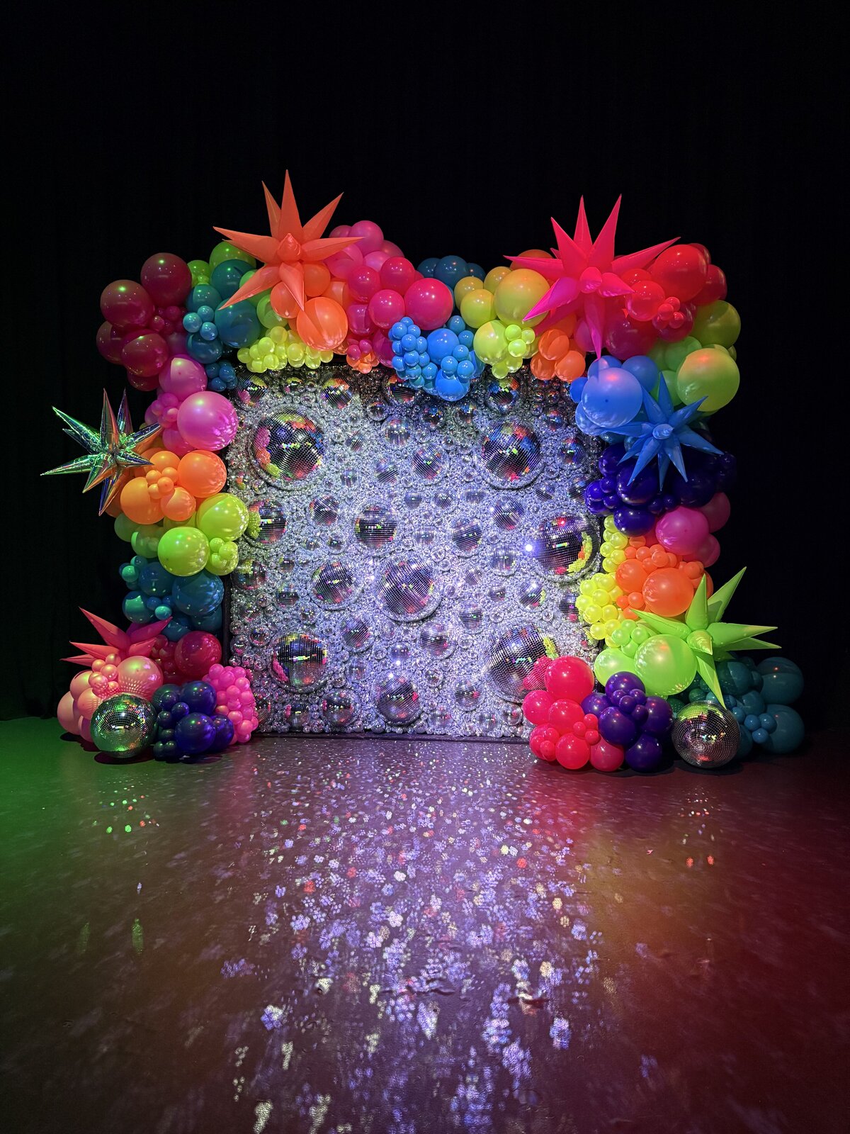 disco ball wall with neon balloons for event in Seattle - Sarahs Celebrations
