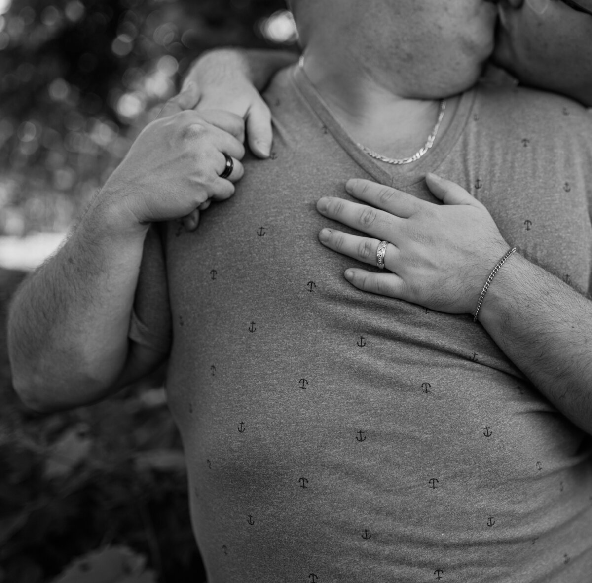 Black and white portrait of a couple embracing