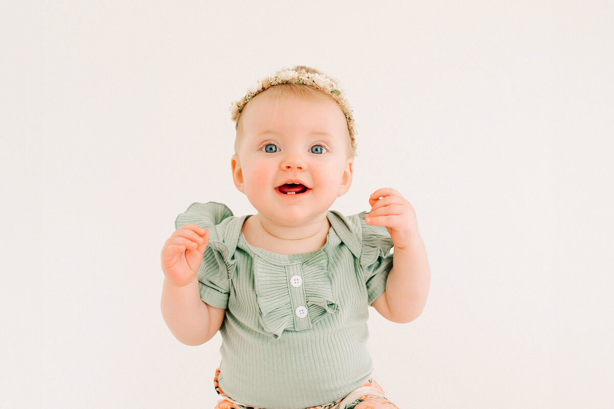 baby girl excited and smiling during Springfield MO kid photography session 