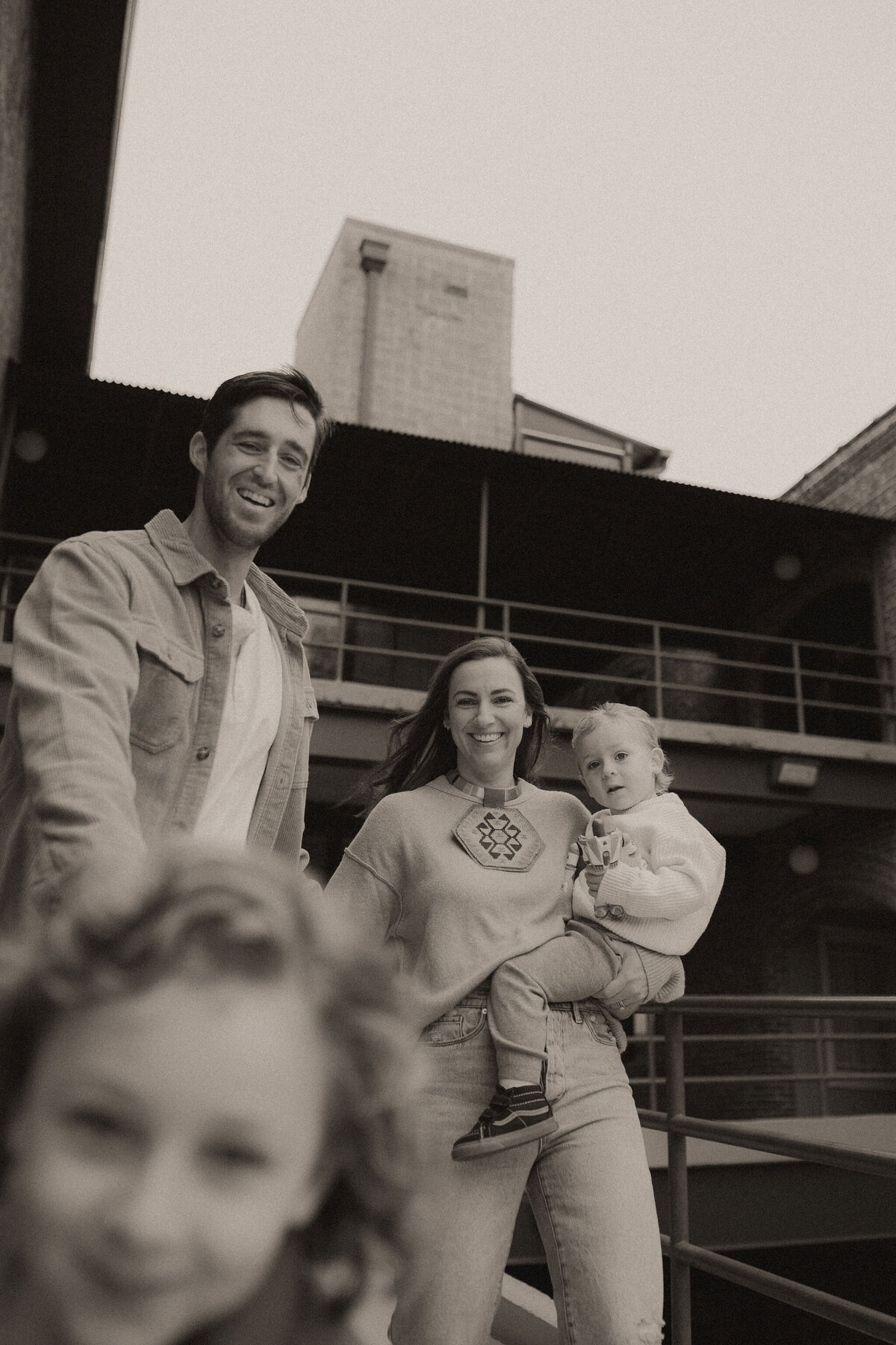 A family of four walking downtown Marietta, GA together. 