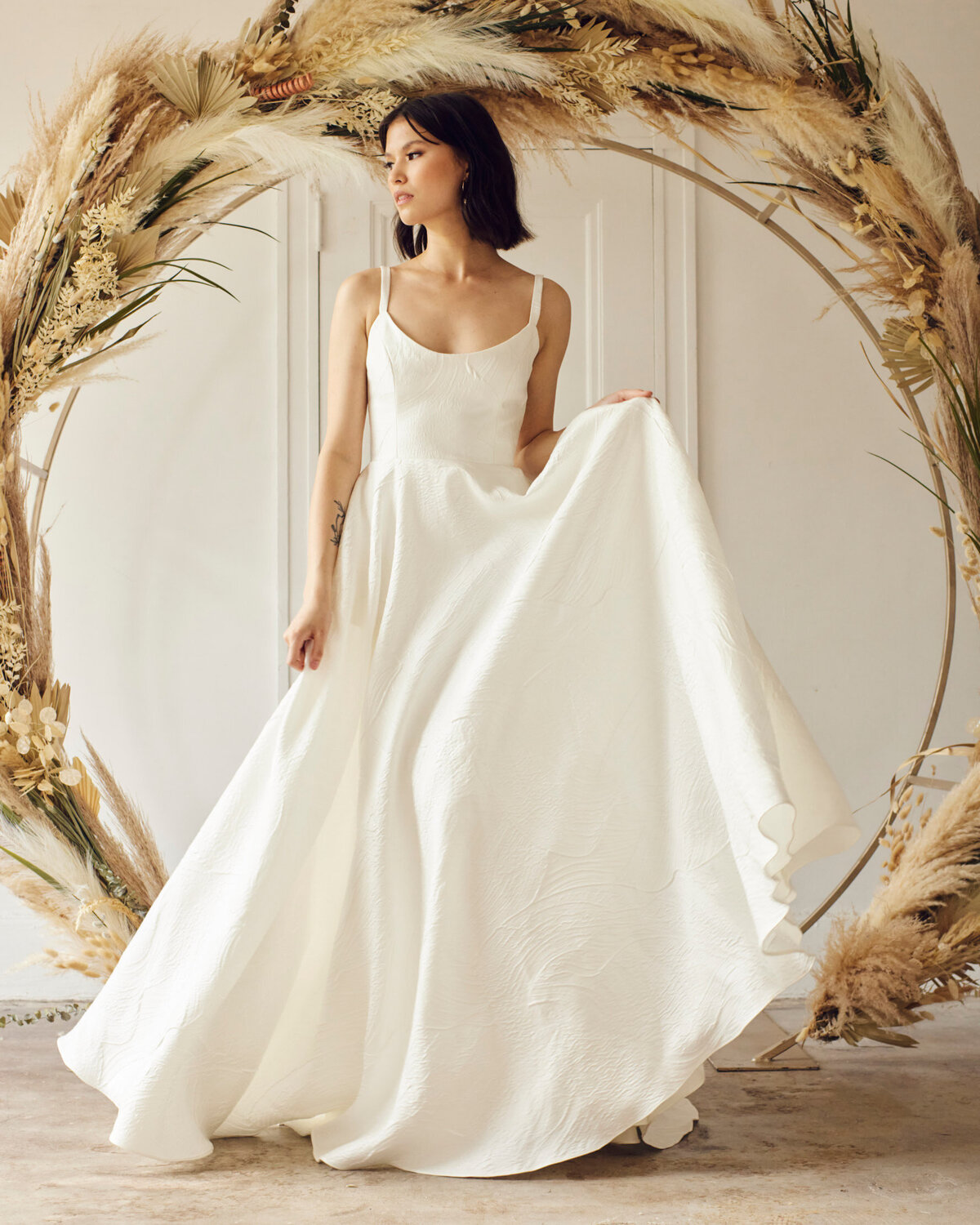 Simple and classic bridal gown from Lovenote Bride, a modern bridal boutique based in Calgary + Vancouver. Featured on the Brontë Bride Vendor Guide.