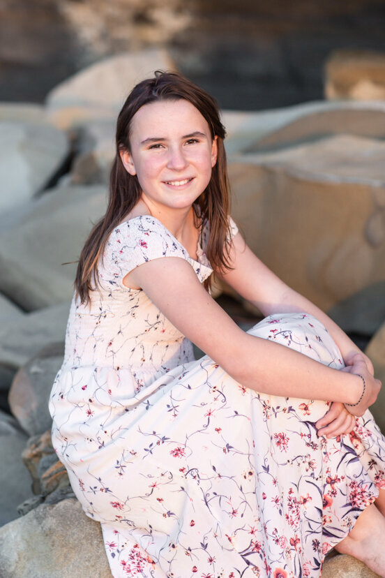young-girl-sitting-on-rock-la-jolla-san-diego