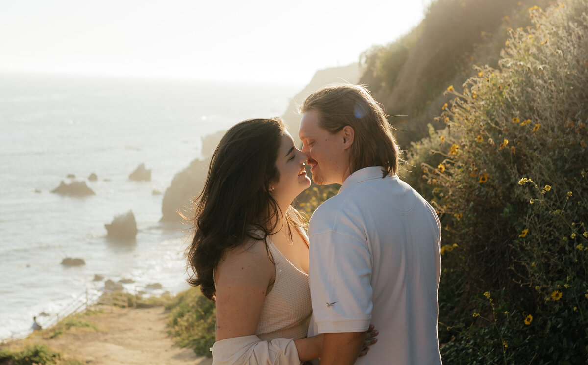 Romantic couple portrait by the ocean, capturing golden hour in Indiana.