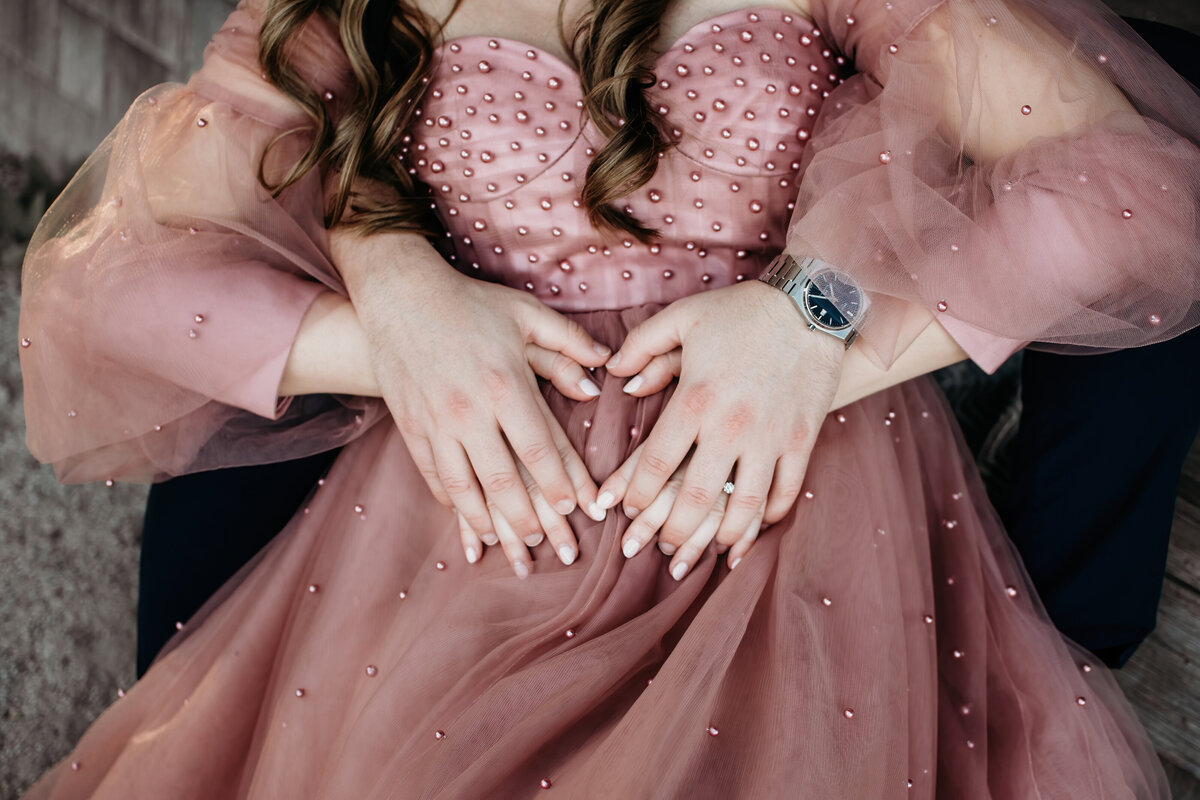 mom and dad feeling  baby girl kicking during a maternity photoshoot in Batavia, IL