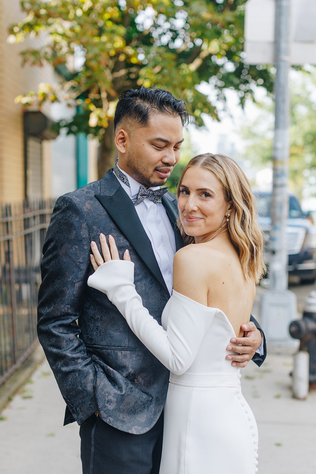 portrait of bride and groom leaning into each other