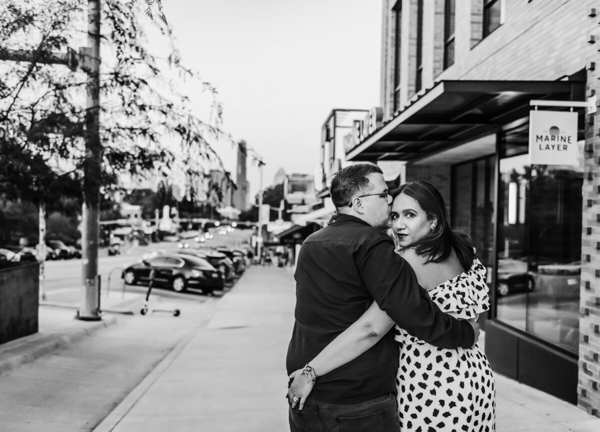 Couples Photography, man and woman walk through town with arms wrapped around each other