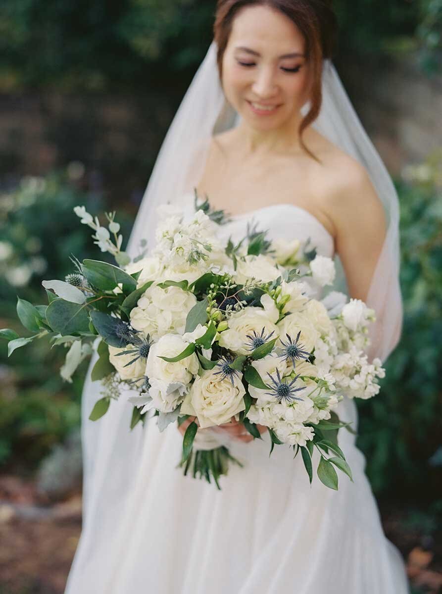 Chinese Bride in Wedding Dress White Roses