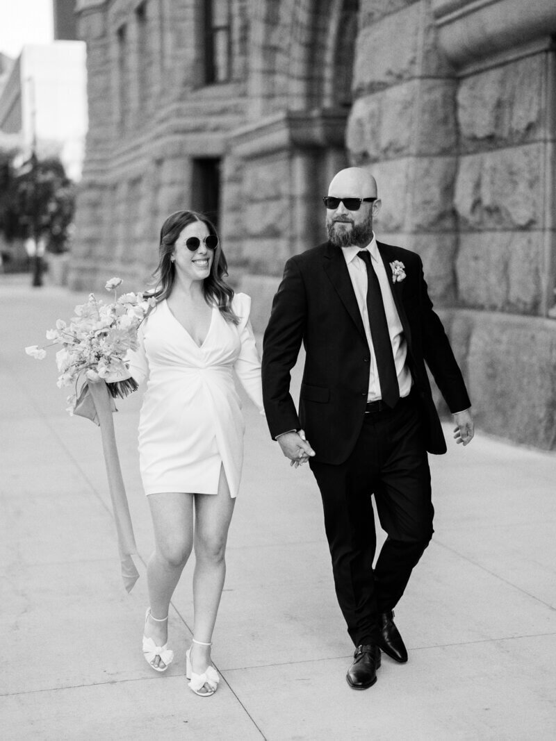 Couple walking through town by wedding planners in chicago