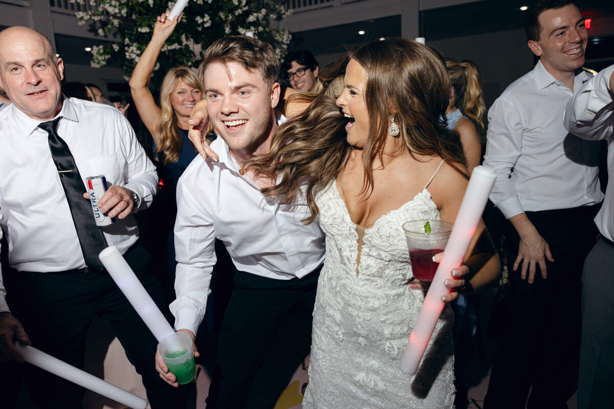 A wedding photo of the bride and groom dancing during the wedding reception