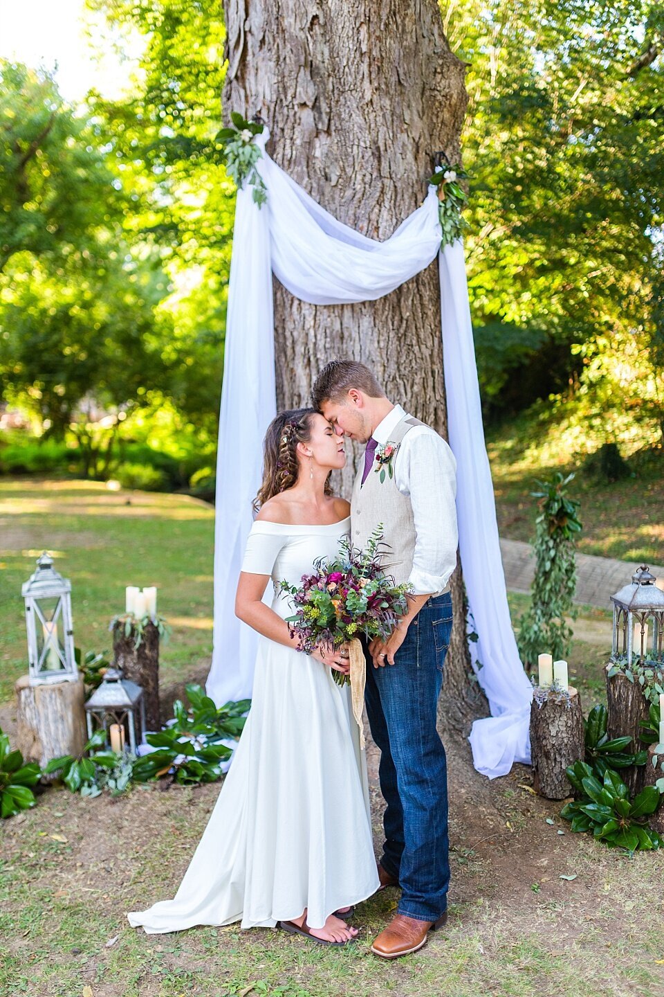 Bride and groom touch foreheads in casual outdoor wedding in Greenville, South Carolina.