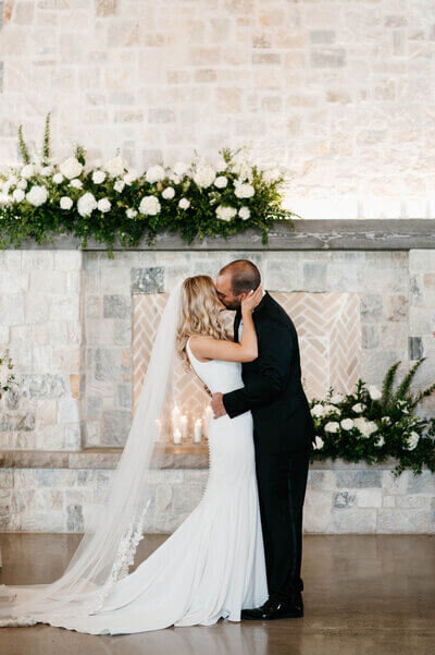 Bride and groom kissing at wedding planned by chicago wedding planners