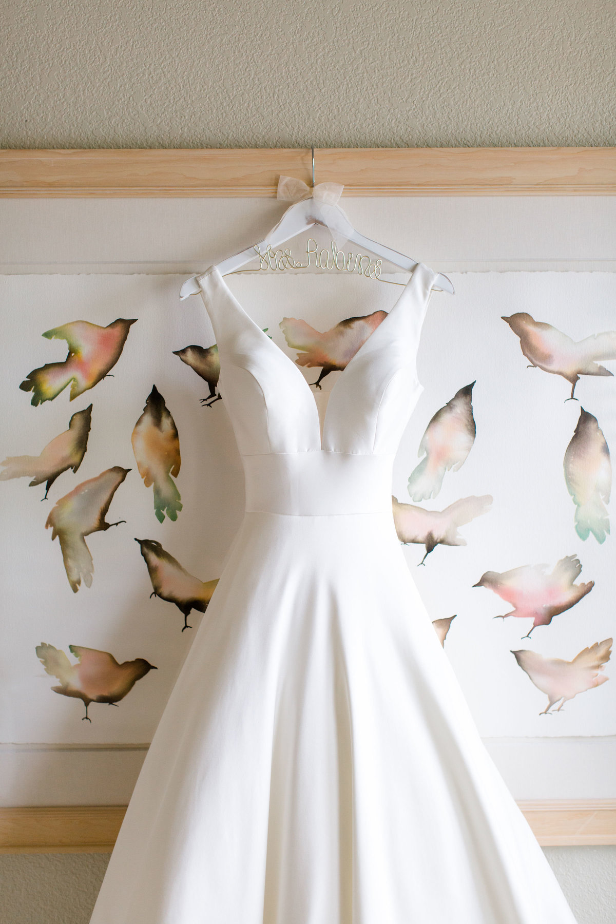 Wedding gown hanging up in bridal suite at Castle Pines Golf Club