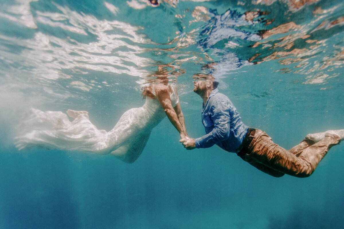 underwater bride and groom portrait