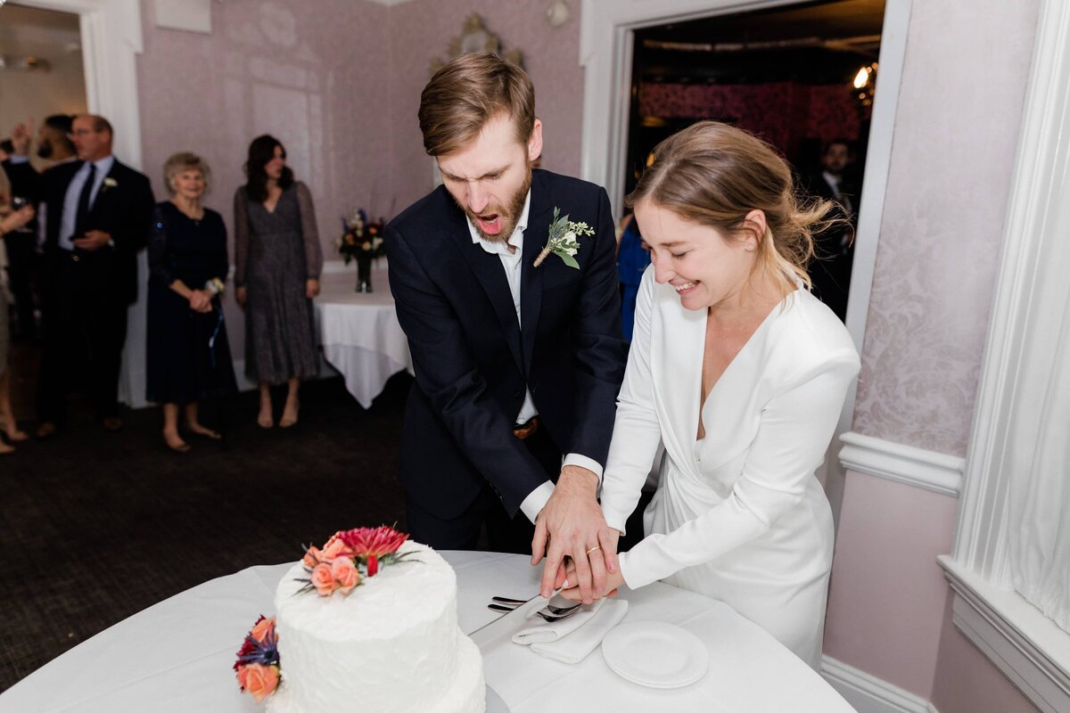 Bride and groom cutting their cake at the Peter Shields Inn in Cape May NJ