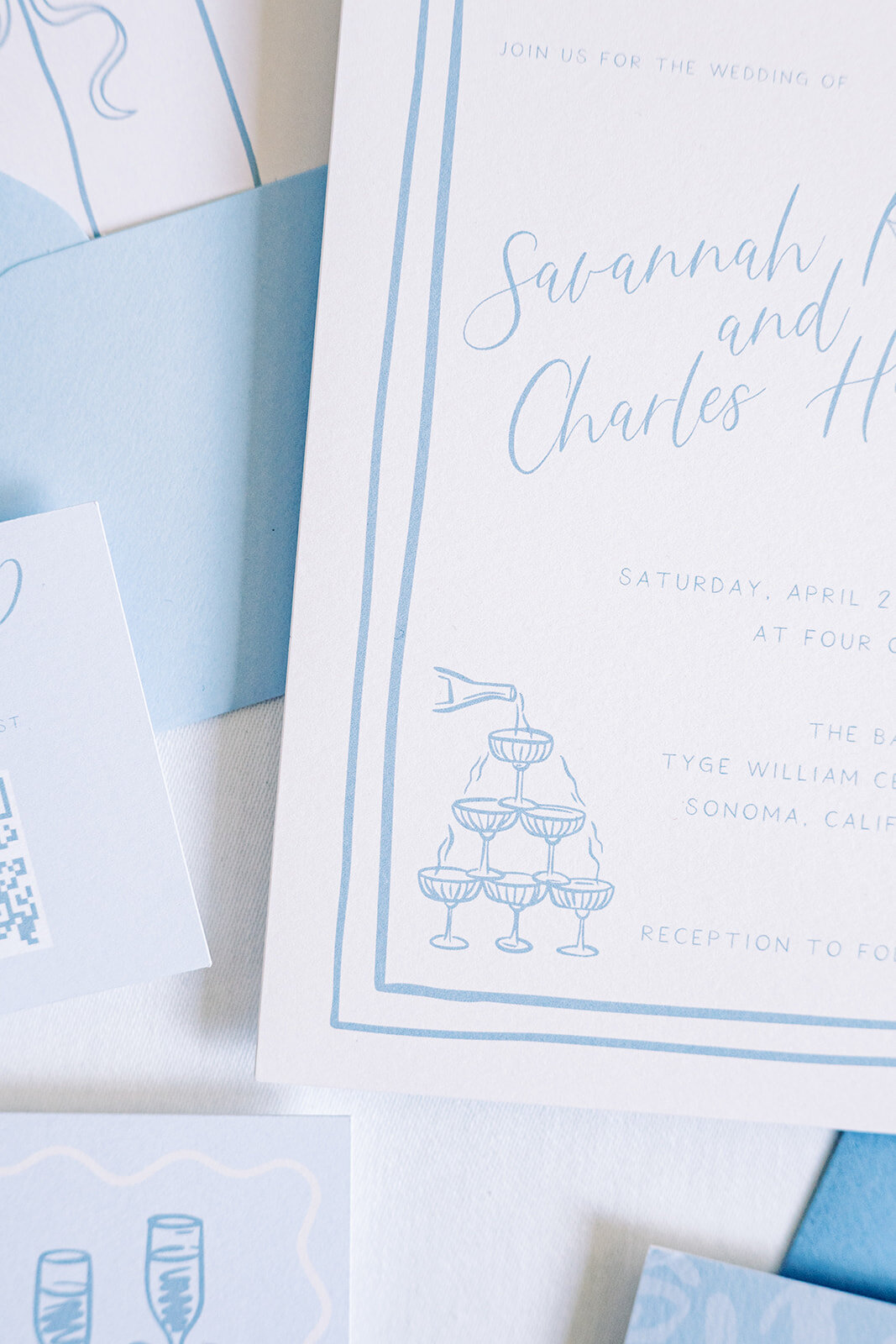 zoomed-in-blue-invite-styled-flatlay-details
