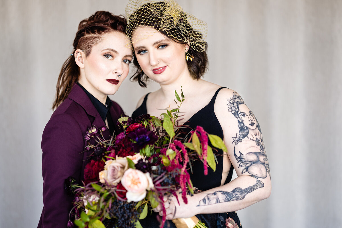 Brides leaning their foreheads against each other
