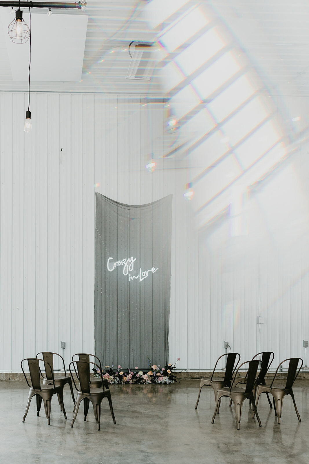Holographic inspired wedding ceremony at 52 North Venue, an industrial and unique wedding venue in Sylvan Lake, AB, featured on the Brontë Bride Vendor Guide.52 North Venue, an industrial and unique wedding venue in Sylvan Lake, AB, featured on the Brontë Bride Vendor Guide.