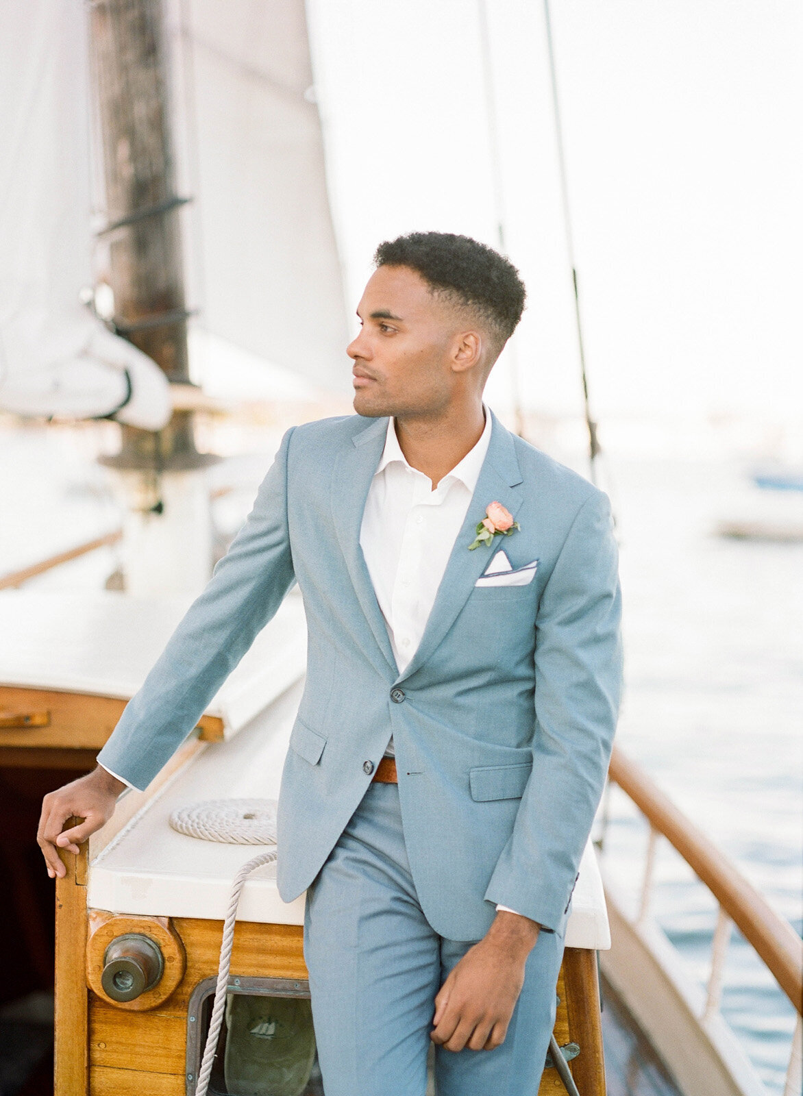 Kate-Murtaugh-Events-elopement-wedding-planner-Boston-Harbor-sailing-sail-boat-yacht-greenery-dapper-groom-blue-suit