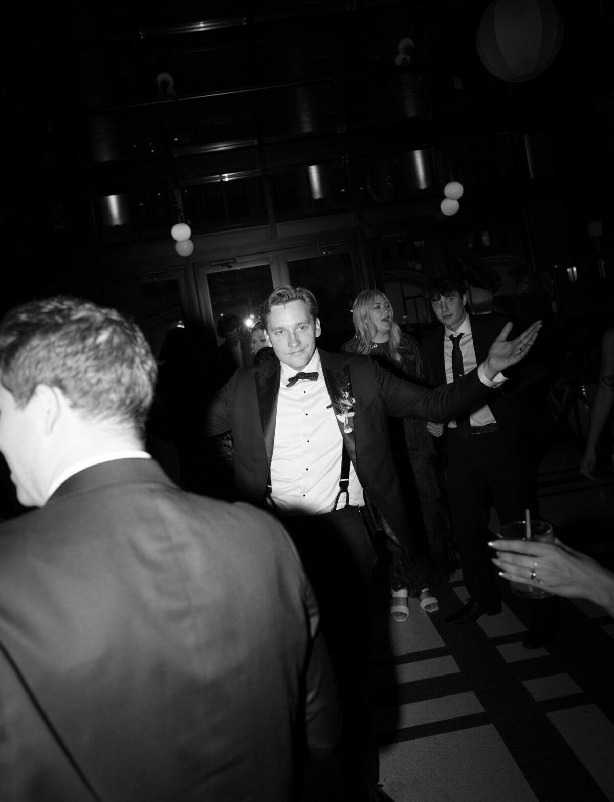 groom dancing at Shinola Hotel wedding reception in birdy room