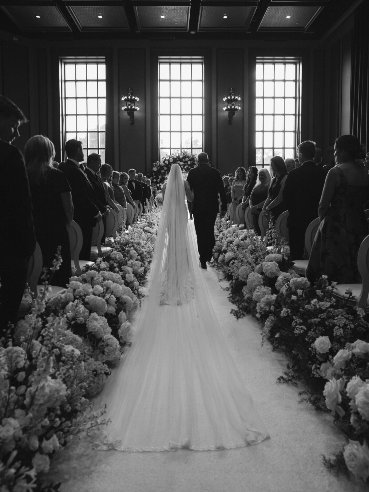 White flowers down the aisle for bepoke wedding ceremony