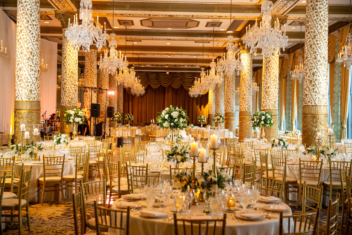 Elegant wedding reception with candles and white roses  in the Gold Coast room at the Drake Hotel.