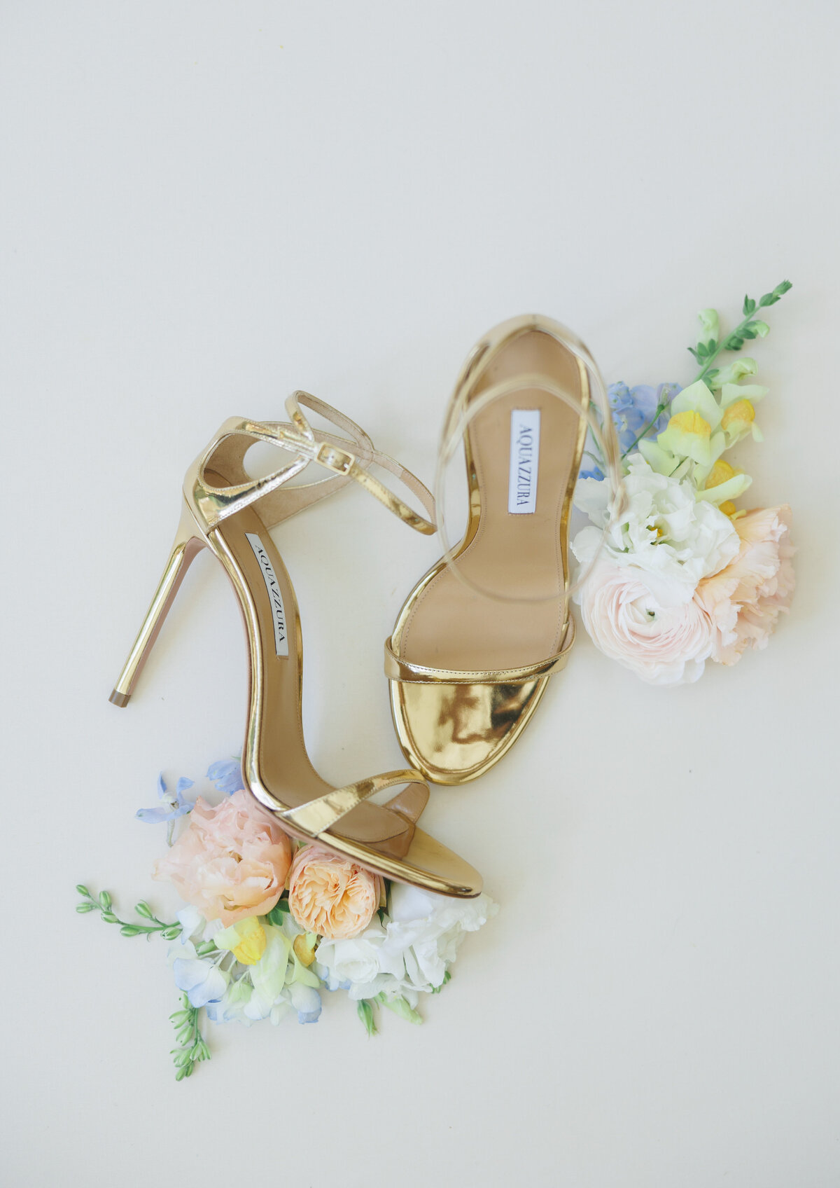 Gold wedding heels, styled with pastel flowers by Millie Fleur Design