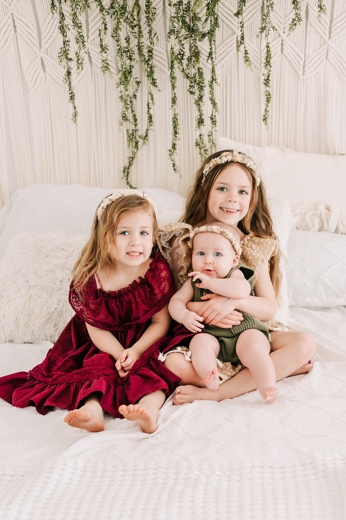 girls smiling and cuddling  during Branson MO family photography session