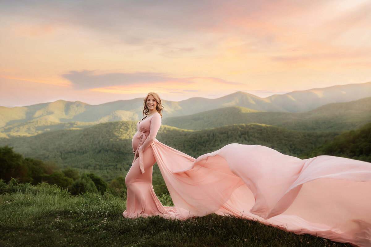 Pregnant woman poses for Maternity Portraits on the Blue Ridge Parkway in Asheville, NC.
